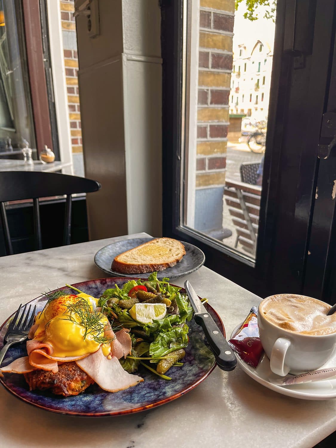 Eggs benedict, by a window