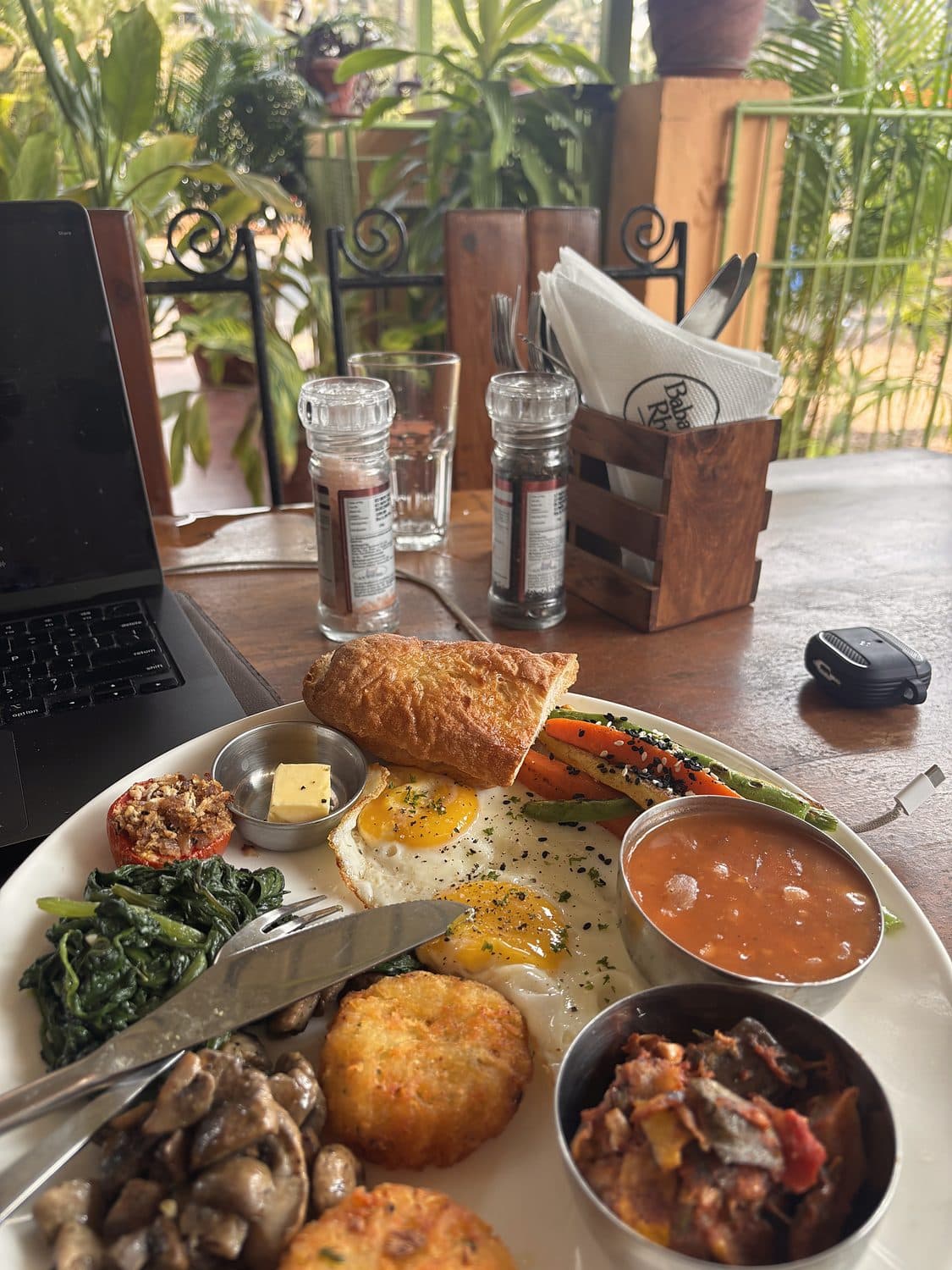The whole breakfast, laptop open — Morjim, North Goa