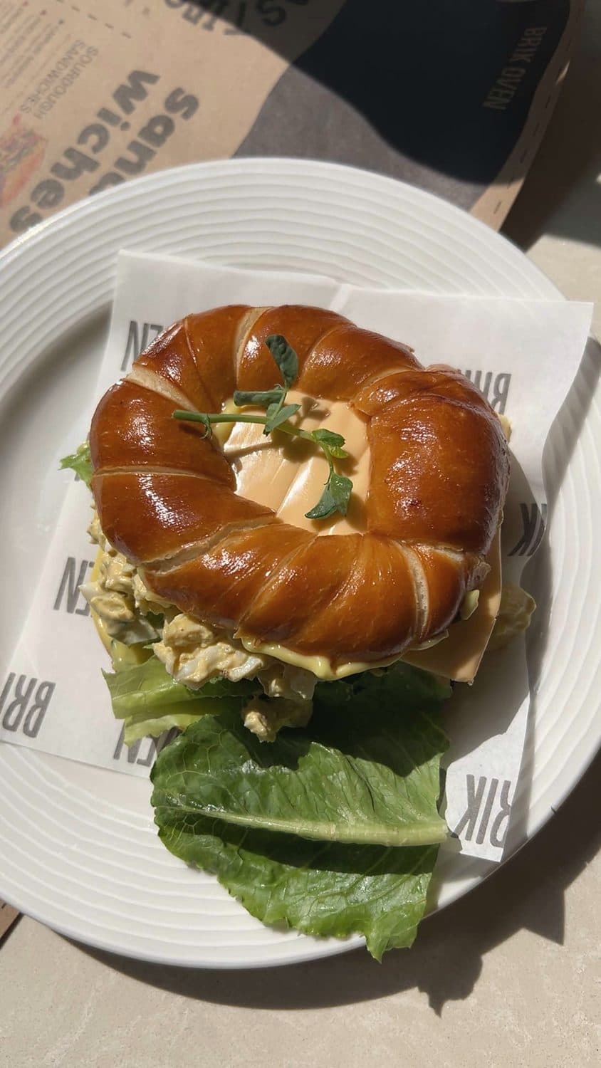 Egg salad in a pretzel bagel