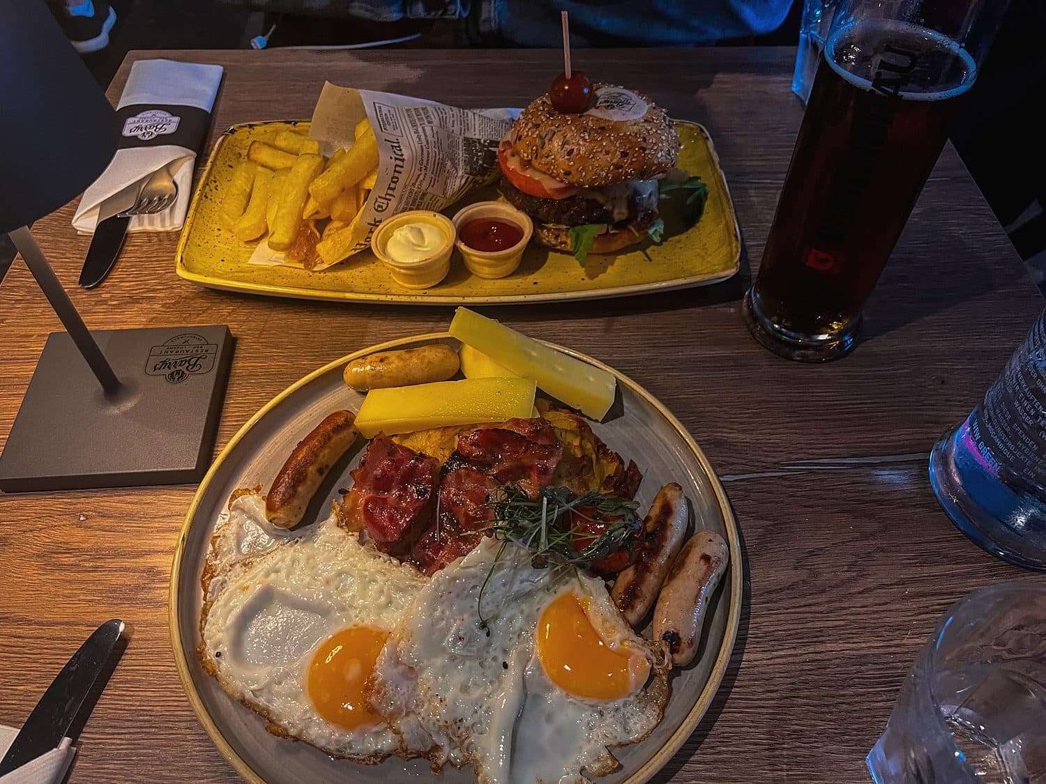 Sausages, fried eggs and a burger, split two ways